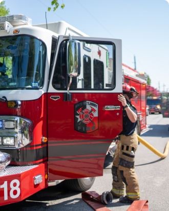 News - Fireman getting in truck