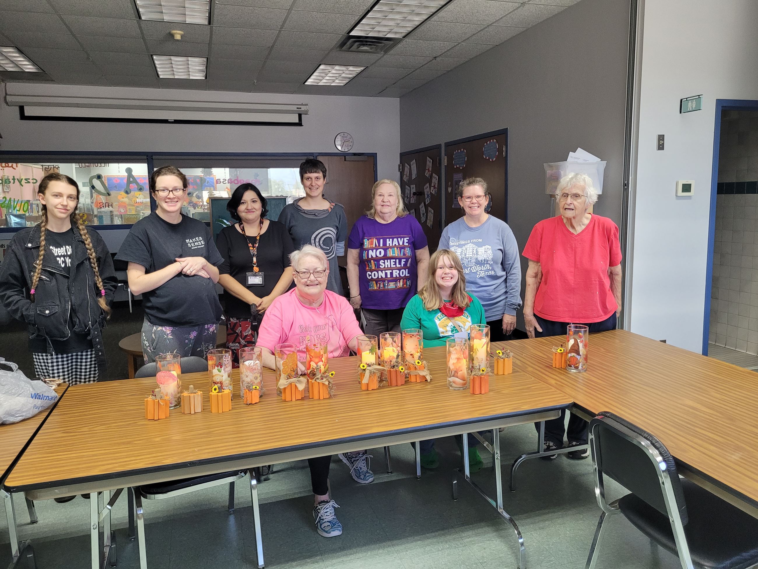 Photo of a group of people with their completed Halloween crafts