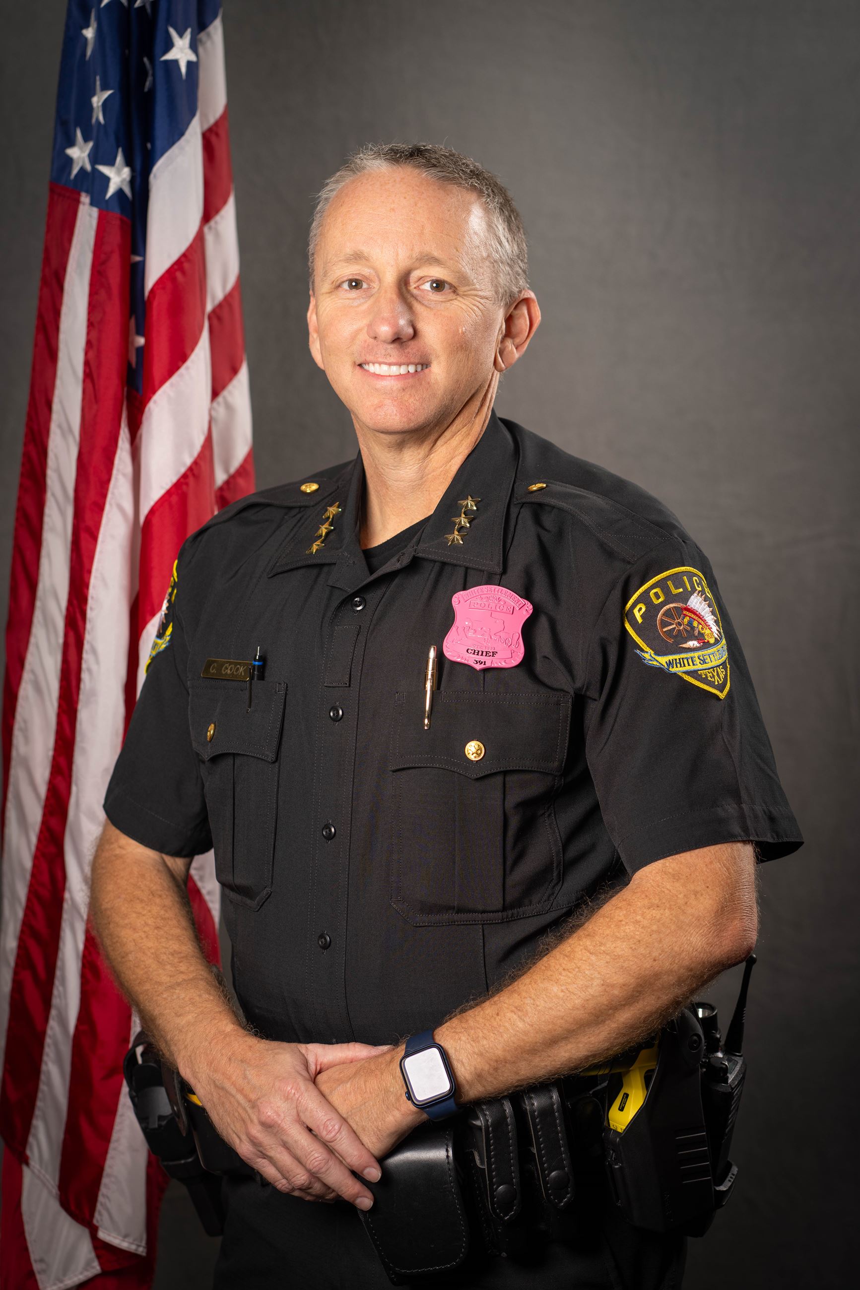 Chief Cook Wearing Breast Cancer Awareness Badge